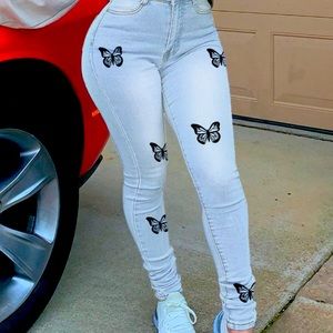 Blue jeans with butterflies.